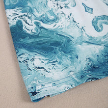 Ladda upp bild till gallerivisning, V-ringad miniklänning i blått tryck