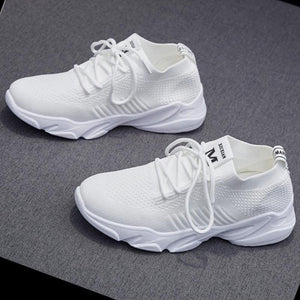 Nya andningsbara stickade sneakers
