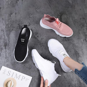 Nya andningsbara stickade sneakers